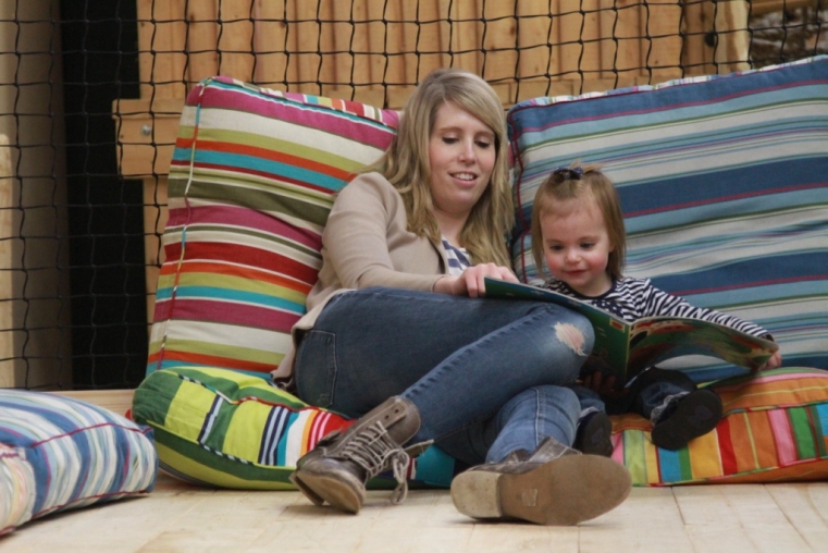 Story time on the comfy cushions in the under 5's play area